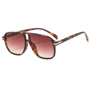 Oversized retro aviator sunglasses for men and women with stylish tortoise shell frames and lenses.