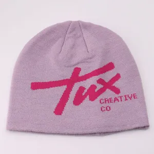 Close up detail of the purple knit beanie hat featuring pink letters twx and creative co.