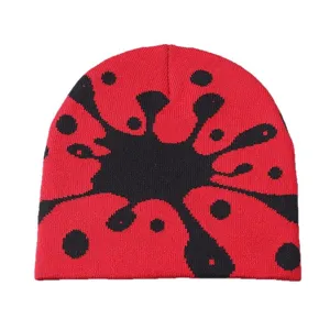 Red and black graffiti knitted beanie, stylish abstract jacquard warm winter hat.