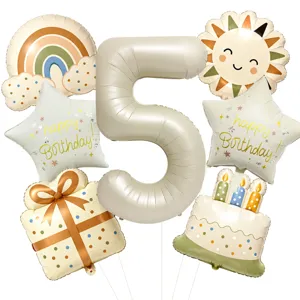 Retro boho 5th birthday balloon set including rainbow, sun, and cake foil balloons for party.