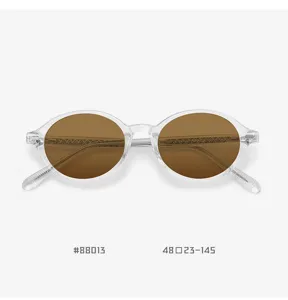 Retro round polarized sunglasses with clear TR90 frame and brown lenses for men and women UV protection