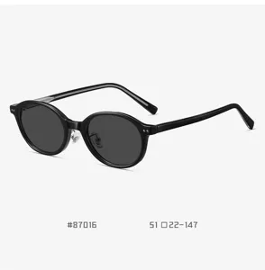 Retro TR90 oval sunglasses for men and women, stylish black nerd frame with polarized lenses.
