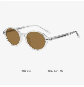 Retro oval TR90 polarized sunglasses with clear frames and brown lenses for stylish daily wear.