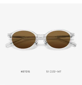 Detail view of trendy TR90 clear frame oval sunglasses with brown lenses for stylish daily wear.