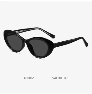 Black cat-eye sunglasses detail, TR90 frame with spring hinge, sleek curved design.