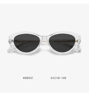 Trendy clear frame cat-eye sunglasses with dark lenses, stylish TR90 spring hinge eyewear.
