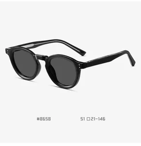 Vintage black round sunglasses detail shot, TR90 pin-leg frame and polarized UV protection.