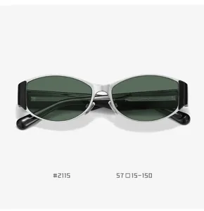 Trendy retro cat-eye sunglasses with silver metal frames and dark green lenses for women.