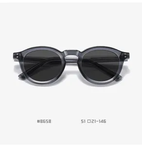 Vintage TR90 round sunglasses for men and women, stylish grey frame with polarized lenses.