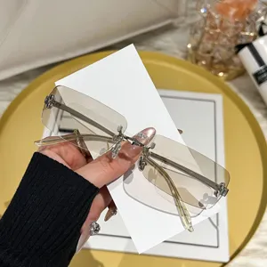 Detail shot of Y2K rimless gradient square sunglasses with metal temples for street fashion.
