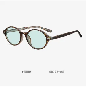Retro tortoiseshell round TR90 eyeglasses with light green lenses and pin detail for use.