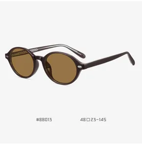 Vintage oval TR90 polarized sunglasses for men and women, stylish retro brown frame.