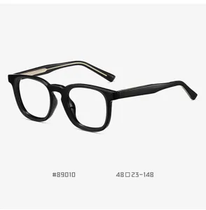 Unisex anti-blue light black optical glasses with thick acetate frame and metal detail.