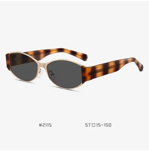 Detailed shot of retro cat-eye sunglasses with tortoise shell temples and metallic gold frame.