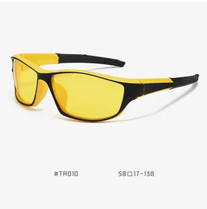 Close-up detail of yellow lens cycling sunglasses with black and yellow frame, lightweight sport eyewear.