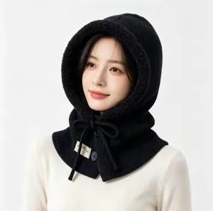 Detailed close-up of the stylish black knitted balaclava showing fine texture and cozy fleece lining.