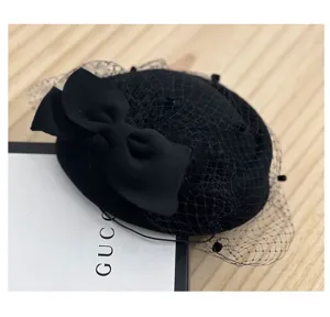 Sombrero pillbox negro de lana con lazo y velo de red, estilo británico elegante para mujer.