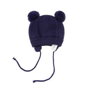 Kinder dunkelblaue Strick-Wintermuetze mit Doppelpompons, Ohrenklappen und warmem Fleecefutter.