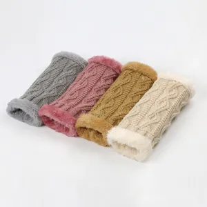 Detailed shot of thick knitted furry cuffs, cozy diamond pattern arm warmers for autumn winter.