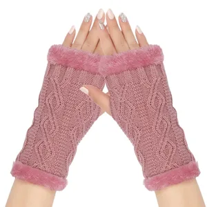 Detailed close-up of pink knit fingerless gloves with cozy faux fur trim and cable knit texture.