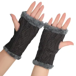 Detailed view of dark grey fuzzy knit fingerless gloves with cable pattern and plush trim for winter.