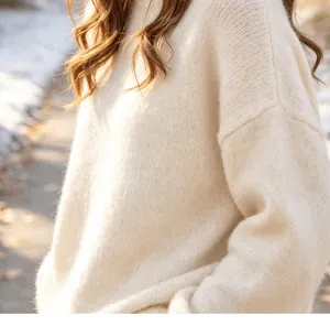 Cozy off-white knit sweater for women, soft slouchy pullover for autumn and winter daily wear.