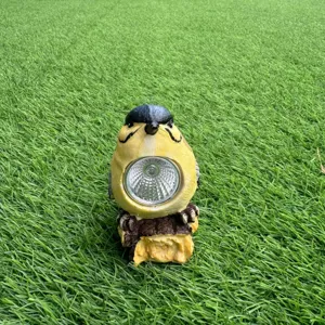 Detailed view of resin bird solar light, cute garden ornament for outdoor lawn yard decor.