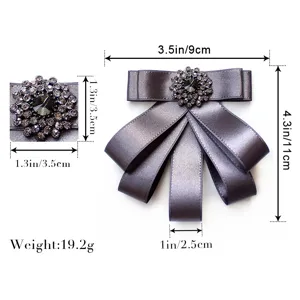 Rinestone satin bow tie detail close-up showing fine crystal embellishments and texture.