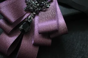 Men elegant purple rhinestone ribbon bow tie detail, exquisite multi-layer lapel pin.