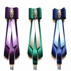 Details of multi-layer ribbon bow collar brooch with pearl rhinestone center for uniform shirts.
