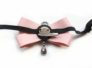 Detail shot showing back structure of pink bow tie with secure brooch pin and alligator clip.