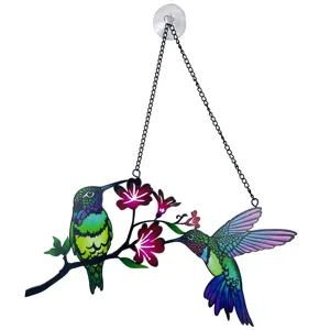 Vibrant metal hummingbird window hanging detail, colorful floral art with chain and suction cup.