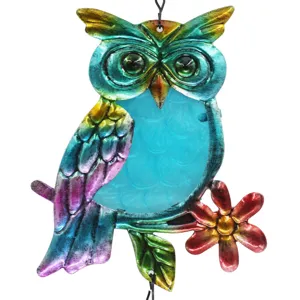 Colorful metal owl hanging ornament detail with stained glass belly and floral accent for decor.