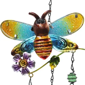 Close-up detail of the colorful iron bee wind chime pendant with vibrant painted glass wings.