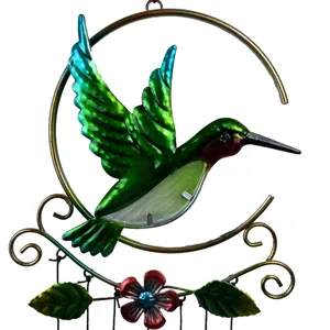 Metal hummingbird wind chime with glass pieces, hanging decorative craft for home and garden.