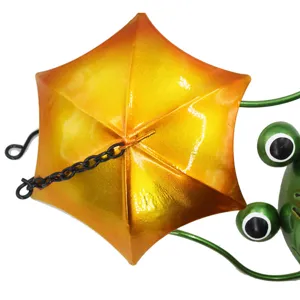 Metal garden frog hanging ornament detail view, creative yellow umbrella wind chime decor for yard.