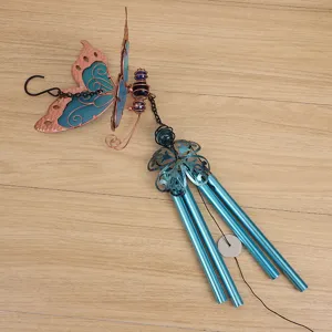 Close-up detail of the metal butterfly wind chime showing blue acrylic wings and tubes.