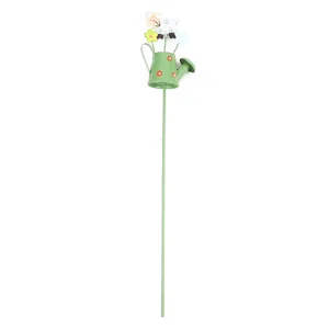 Metal garden stake detail, cute sheep and watering can design, perfect for potted plants decoration.