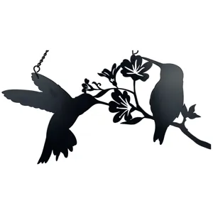Black metal hummingbird silhouette hanging art detail, elegant window and wall decor piece.