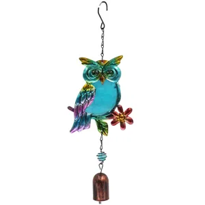 Detailed shot of colorful glass owl wind chime, metal hanging garden decor ornament.