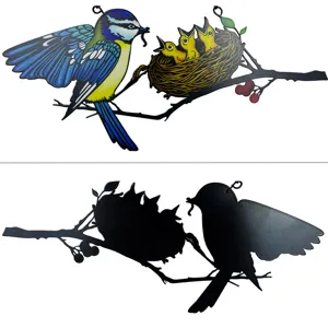 Detailed view of the metal bird hanging decoration, showing colorful front and black back.