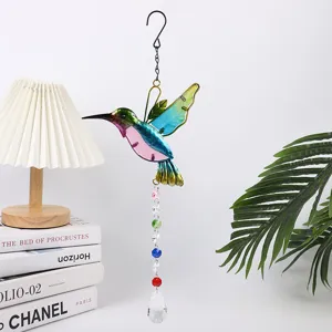 Crystal hummingbird suncatcher pendant with rainbow crystals, perfect for garden window decoration.