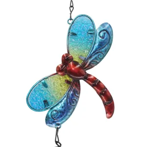 Metal and glass dragonfly wind chime detail close-up, colorful painted hanging home decor ornament.