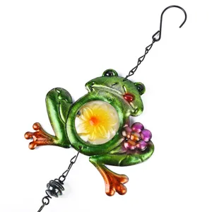 Metal frog glass wind chime detail, colorful garden hanging ornament for outdoor yard decor.