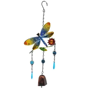 Detailed view of colorful metal dragonfly wind chime with hanging beads and bell for garden.