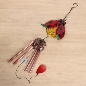 Metal glass ladybug wind chime detail view, hanging ornament, vibrant garden decor piece.
