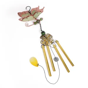 Close-up detail of the luminous butterfly wind chime featuring glowing acrylic sheet and metal tubes.