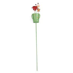 Metal garden stake with cute cow and red heart design, perfect for potted plants and yard decor.