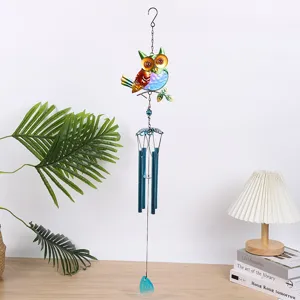 Handmade colorful iron and glass owl wind chime hanging ornament for garden and patio decoration detail.