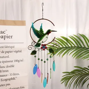 Metal hummingbird wind chime with colorful glass pendants, hanging decor for garden and home.